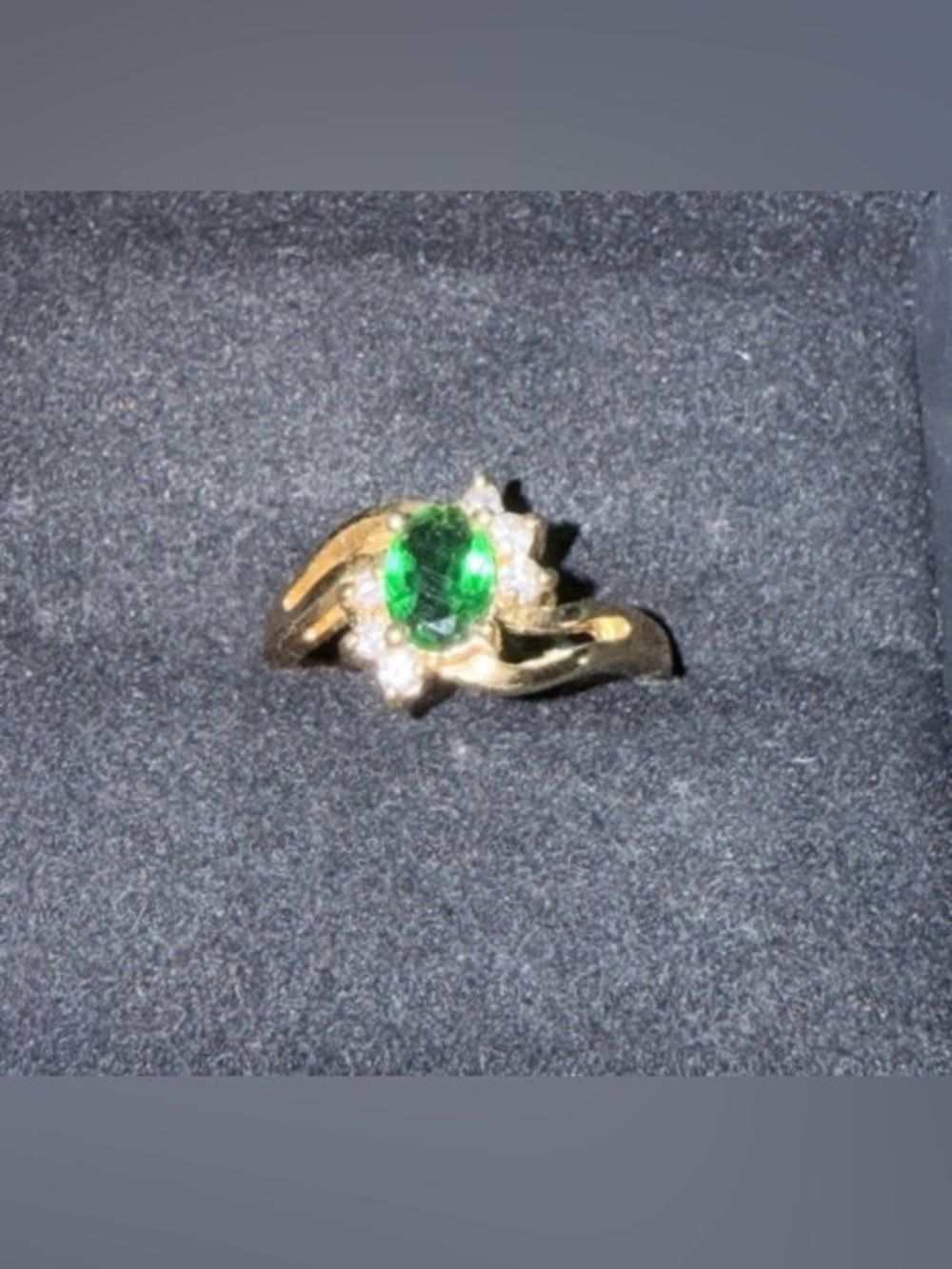 18K Gold-filled bypass style ring with a green center stone & small clear stones